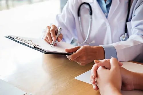 depositphotos_239284710-stock-photo-patient-listening-intently-male-doctor